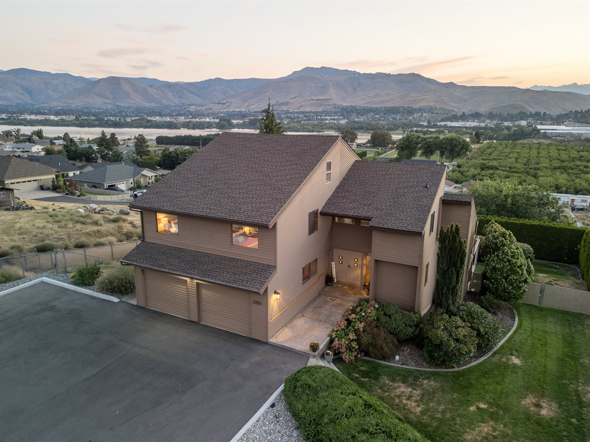 Stunning drone view of property with mountain panorama