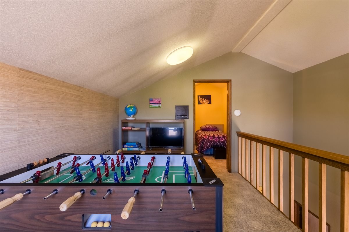 Adventure loft bedroom with foosball and games