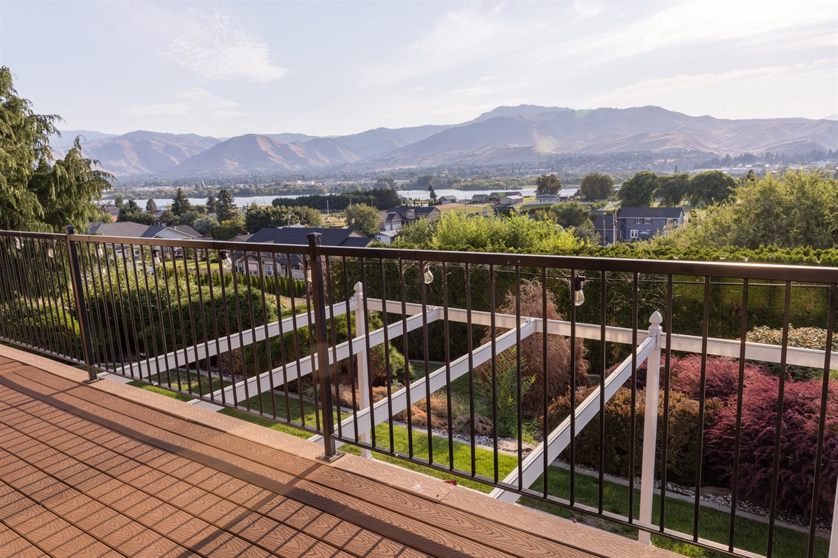 Sun-soaked deck with panoramic mountain and river views